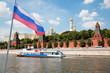 Russian flag on background of Moscow Kremlin and Moscow River