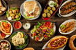 Various Mediterranean dishes and bread on table