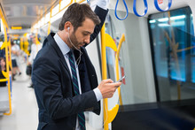 Businessman Commuter Traveling On The Metro Underground
