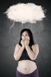 Pregnant woman worried something with bubble cloud