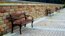 Row Of Benches In Promenade In Evening