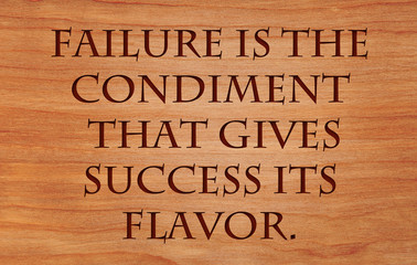 failure is the condiment that gives success its flavor - quote on wooden red oak background