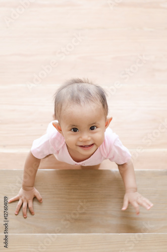 when do babies crawl up stairs