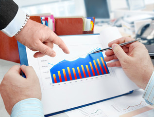 Fototapete - Closeup of hands with financial  charts  at business meeting in the office