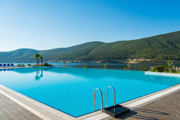 Poster - Nice swimming pool outdoors on bright summer day