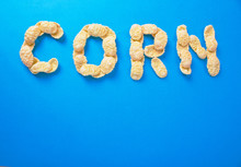 Word Of Corn Flakes On A Blue Background, Lettering