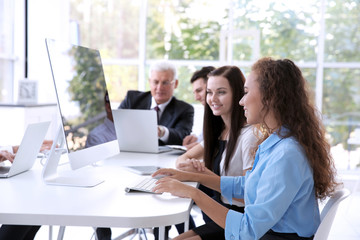 Poster - Business training concept. Colleagues working on computers at office