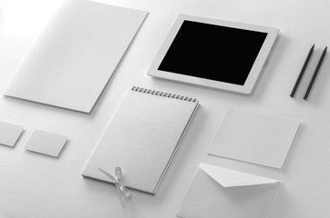 Brand identity mockup. Corporate stationery set at textured background.