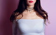 Close up fashion young woman with black choker on her neck