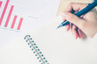 © justyle - Business women hands working writing notebook on wooden desk, lighing effect