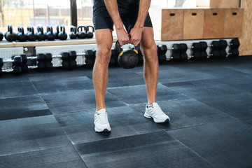 Wall Mural - Cropped image of man with weight