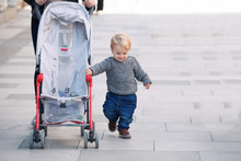 Walking Mother With Baby Carriage