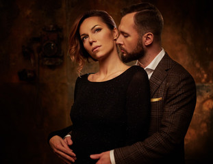 Wall Mural - Portrait of well-dressed couple in expression of feelings