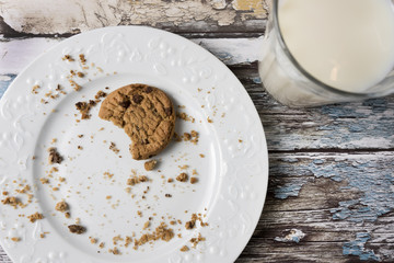 Cookies and Milk / Top View of Cookies and Milk on a Wooden Background