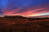 Fototapeta Na ścianę - Kolorowy zachód słońca nad polami, wioską.