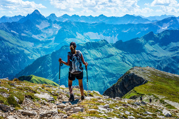 several mountain ranges loom ahead for lone hiker