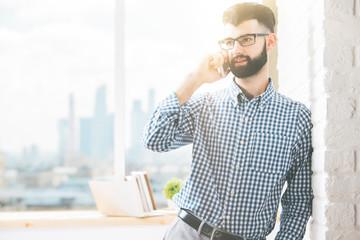 Wall Mural - Handsome businessman on the phone