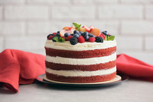 Delicious Cake With Fruit And Berries Decoration On Gray Table