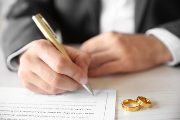 Wall Mural - Man signing marriage contract, closeup