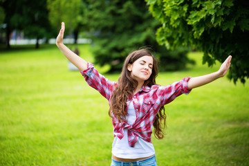 Wall Mural - Young laughing girl in the park.