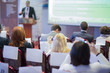 © danmorgan12 - Expressive Lecturer at the Conference Speaking to the Group of Business People At the Conference