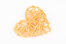 Orange Woven Valentines Day/Christmas/ Mothers Day/ Anniversary Decorations - Heart Isolated, On White Background. Wicker Heart. Closeup.