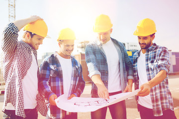 Canvas Print - group of builders with tablet pc and blueprint