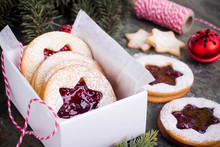 Christmas Or New Year Homemade Sweet Present In White Box. Traditional Austrian Christmas Cookies - Linzer Biscuits Filled With Red Raspberry Jam. Festive Decoration
