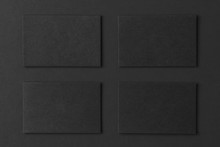 Mockup Of Black Business Cards Arranged In Rows At Black Paper