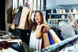 © JackF - Girl having shopping paper bags in hands