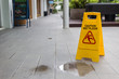 © SKT Studio - Yellow wet floor warning sign on the floor in hotel