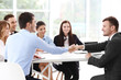 © Africa Studio - Business people shaking hands at office