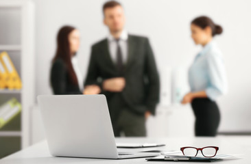 Poster - Working place with computer and business people on background