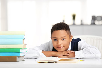 Wall Mural - Cute boy at lesson in school