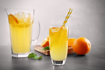 Canvas Print - Glass of refreshing orange drink on table