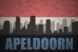 abstract silhouette of the city with text Apeldoorn at the vintage dutch flag
