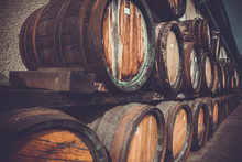 Wooden Barrels In The Distillery Folded In The Yard In Shelves