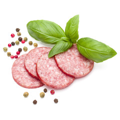 Salami smoked sausage slices, basil leaves and peppercorns isola