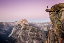 Man On Overhanging Rock At Glacier Point, Yosemite National Park, California, USA