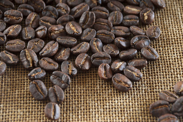 Coffee of Guatemala on grunge wooden background. roasted coffee beans on the table in perspective.