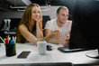 © djrandco - Two Young Professionals Enjoying Their Work