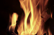© FRANCISGONSA - Flames of fire in a fireplace. Shooting horizontal with tones Orange and black.