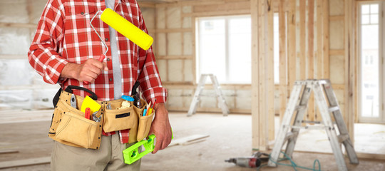 Builder handyman with paint roller.