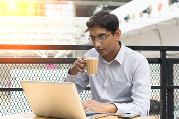 indian business man having milk tea