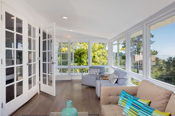 Bright solarium-style sunroom off the master suite.