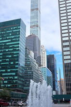 NEW YORK CITY - SEPTEMBER 24, 2016: Looking Up Between The Skyscrapers On Lexington Avenue From The Plaza With A Fountain In Front Of Of The Seagram Building