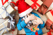 © Prostock-studio - Happy child with Christmas present boxes and gifts, top view