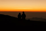 Fototapeta Natura - Silhouette couple lovers watching sunrise