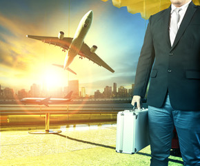 Canvas Print - business man and breifcase standing in airport terminal building