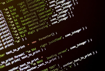 Wall Mural - code language on a computer screen with shallow depth of field.